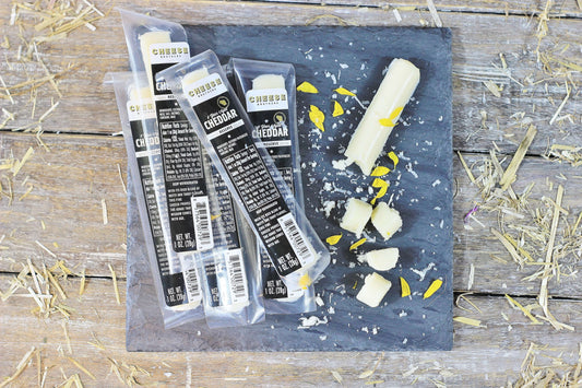Cheese Brothers Inc. 8-Year Aged Cheddar Snack Sticks 30-pack, crispy cheese snack sticks with aged cheddar flavor.