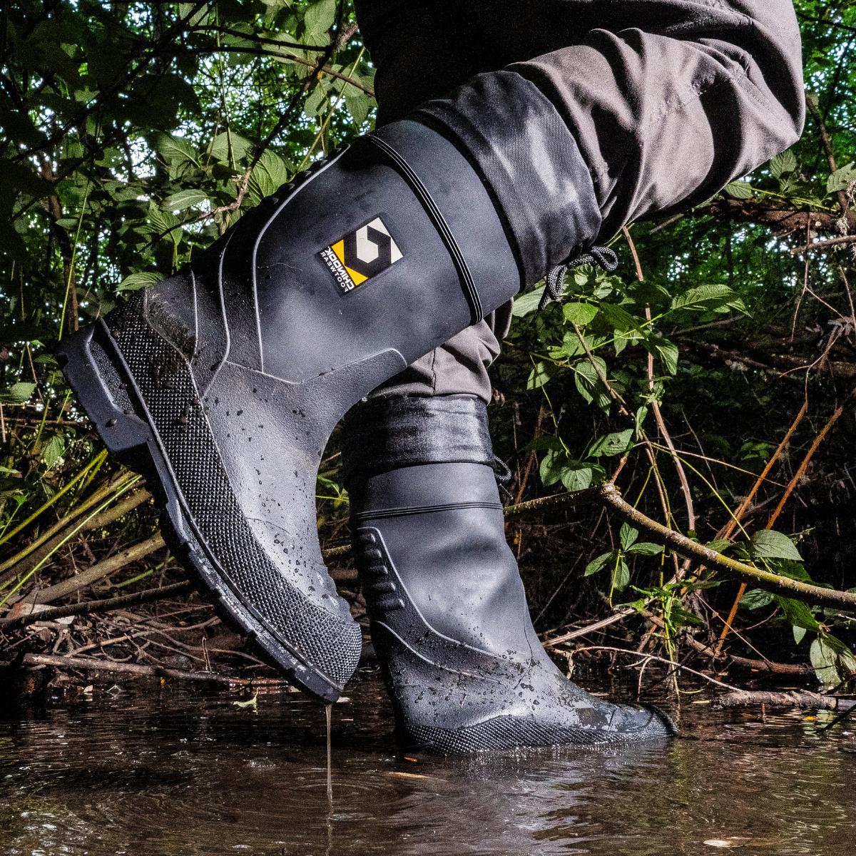 Chinook® Badaxe Regrind 15-inch waterproof rubber boot in black, designed for durability and protection in wet conditions.