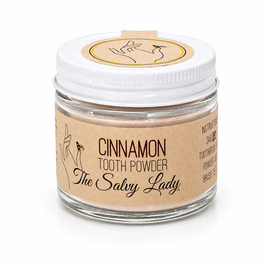 Cinnamon-flavored 2 oz fluoride-free tooth powder by The Salvy Lady, displayed in a jar with cinnamon sticks and natural ingredients.