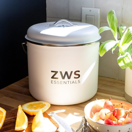 White countertop compost bin from ZeroWasteStore.com, compact kitchen compost container with lid for food waste collection.