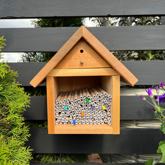 Cedar bee house for solitary bees with multiple nesting compartments, designed by CrownBees for pollinator habitat.