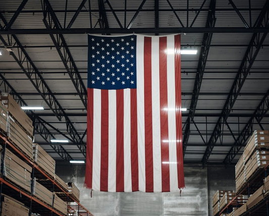 Double-sided American flag for vertical display, made in the USA, featuring vibrant stars and stripes, by Flagman of America.