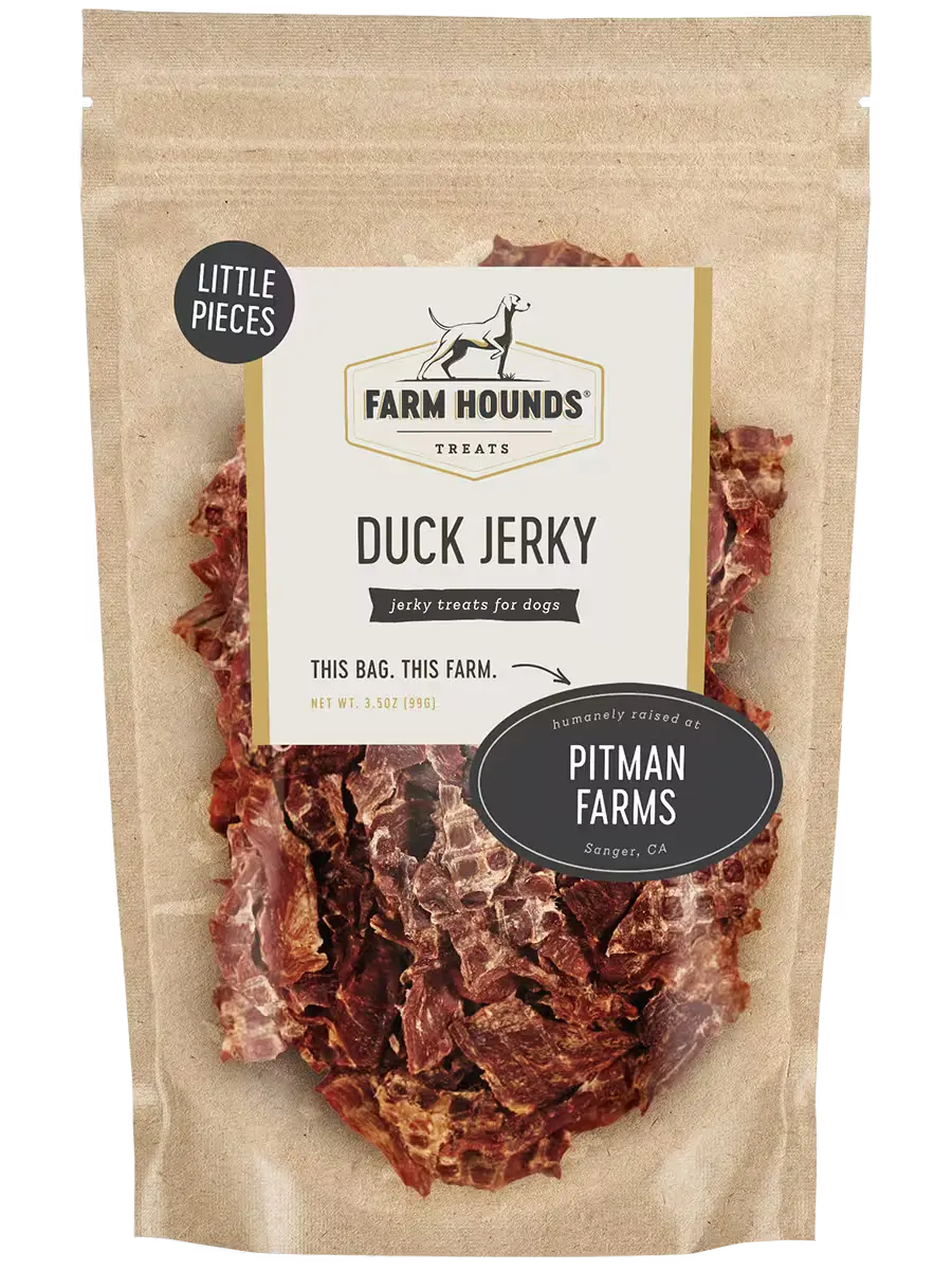 Farm Hounds duck jerky pieces, natural dog treat made from dried duck meat, showing small, chewy jerky strips.