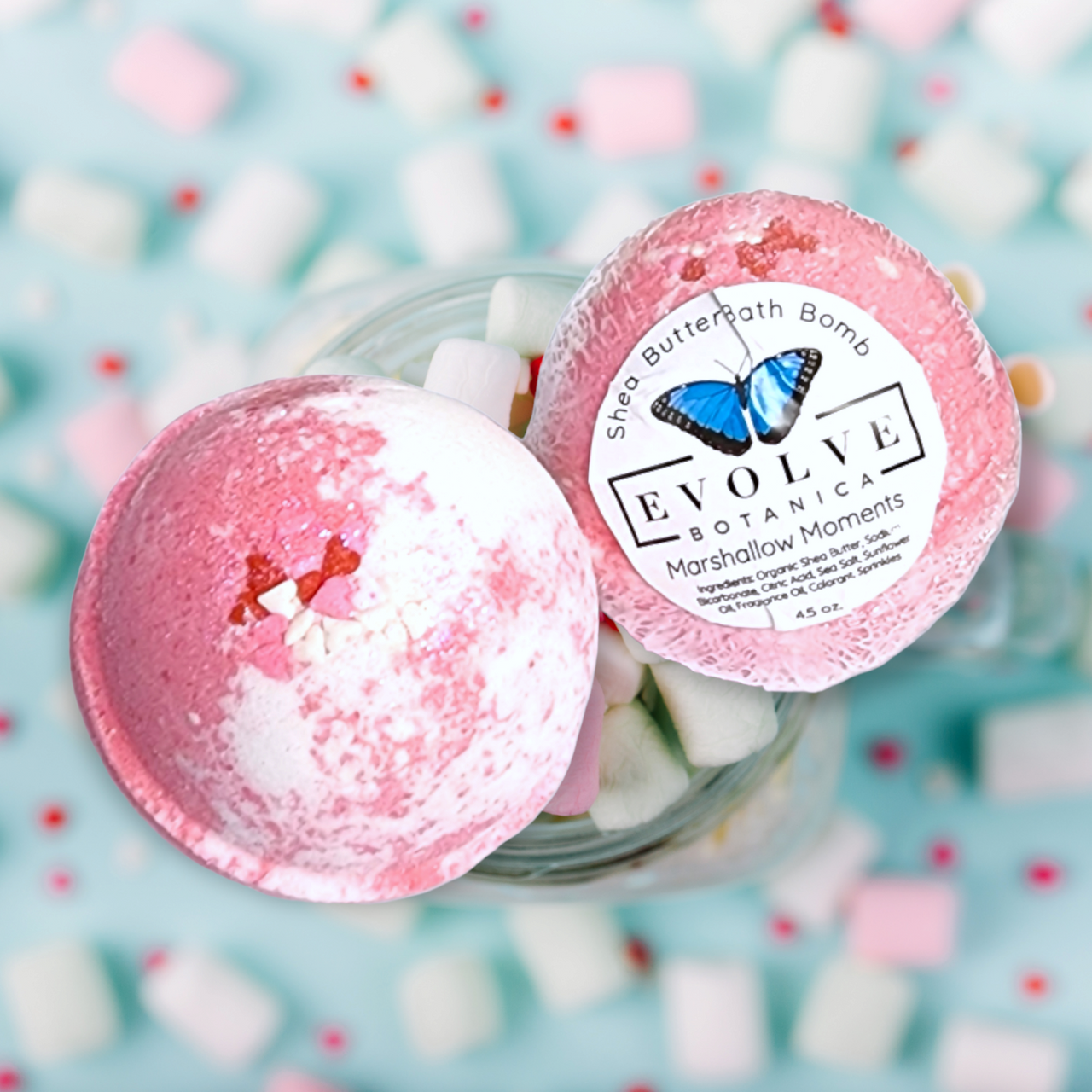 Evolve Botanica Marshmallow Moments bath bomb with white and pink swirls, perfect for Valentine's Day and holiday relaxation.