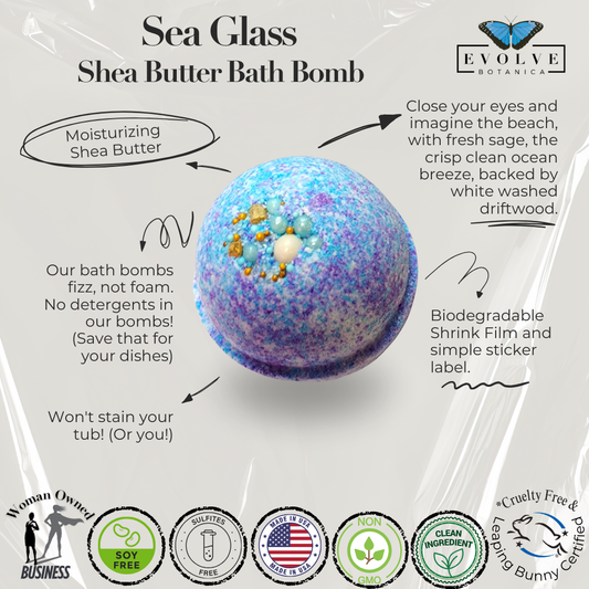 Evolve Botanica Sea Glass Bath Bomb with vibrant blue and green colors, floating in a clear water bath, showcasing a relaxing spa experience.