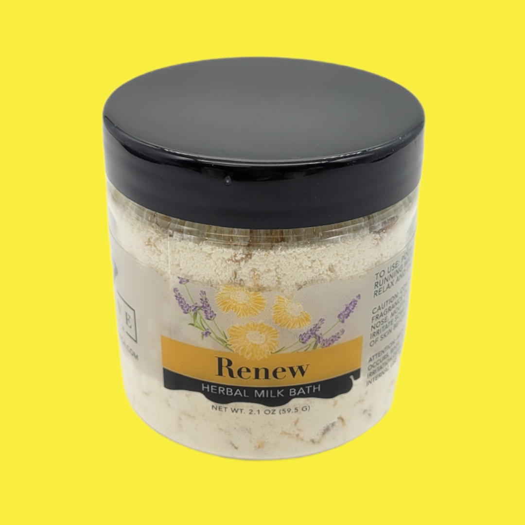 Mini herbal Milk Bath Renew by Evolve Botanica, featuring dried herbs and a soothing, creamy bath product in a clear container.