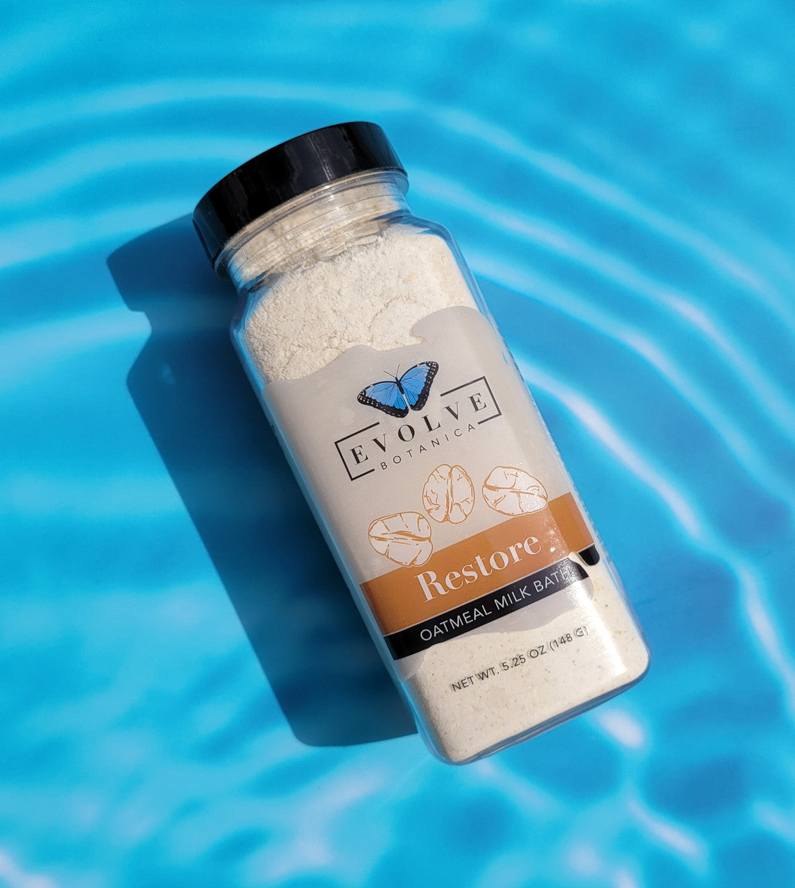 Evolve Botanica Milk Bath Restore with oatmeal in a jar, showcasing the soothing, creamy milk bath product for relaxing skincare.