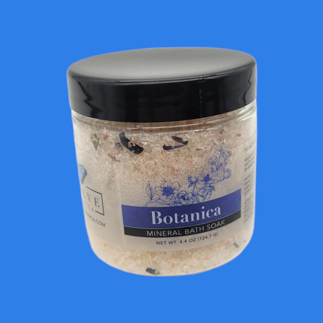 Mini Evolve Botanica Mineral Soak bath salt in a clear container, showcasing natural mineral crystals for relaxing bath experiences.