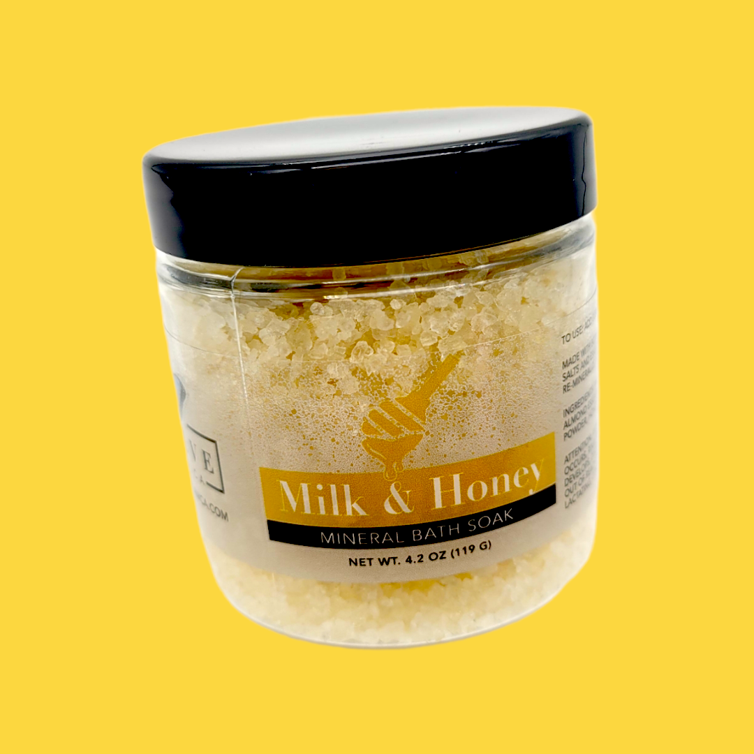 Mini Mineral Soak Bath Salt by Evolve Botanica with Milk and Honey, showcasing the soothing, creamy bath salt in a compact container.