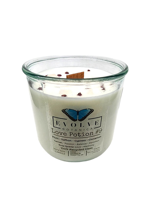 Evolve Botanica Rocks Candle Love Potion #9 with garnet and rose quartz gemstones, soy wax, and wood wick for a calming ambiance.