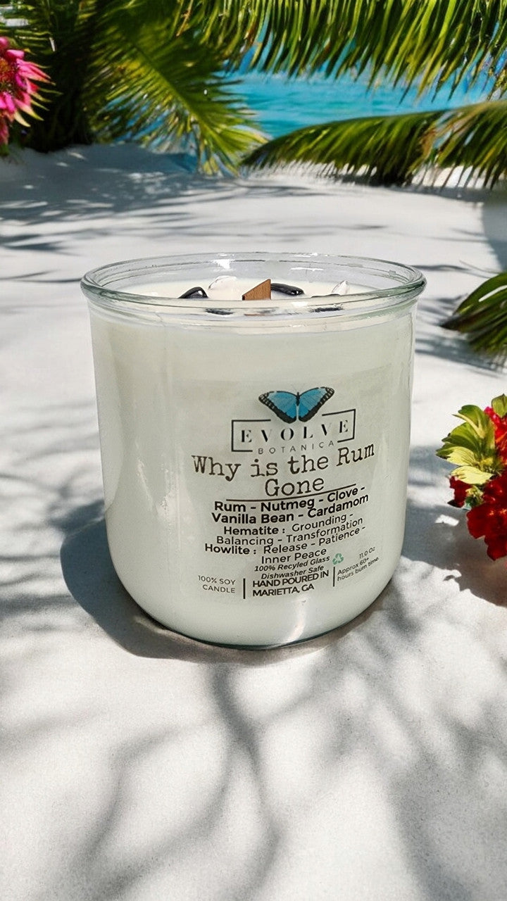Evolve Botanica Rocks Candle with wood wick, hematite for grounding and transformation, and howlite for patience and inner peace.