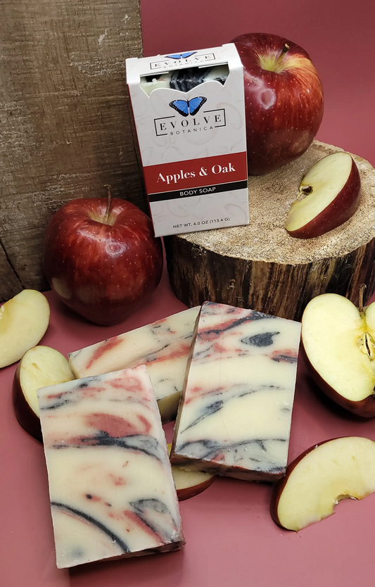 Evolve Botanica Standard Soap in Apples & Oak scent, packaged in unprinted glassine bag, showing the soap's natural texture.