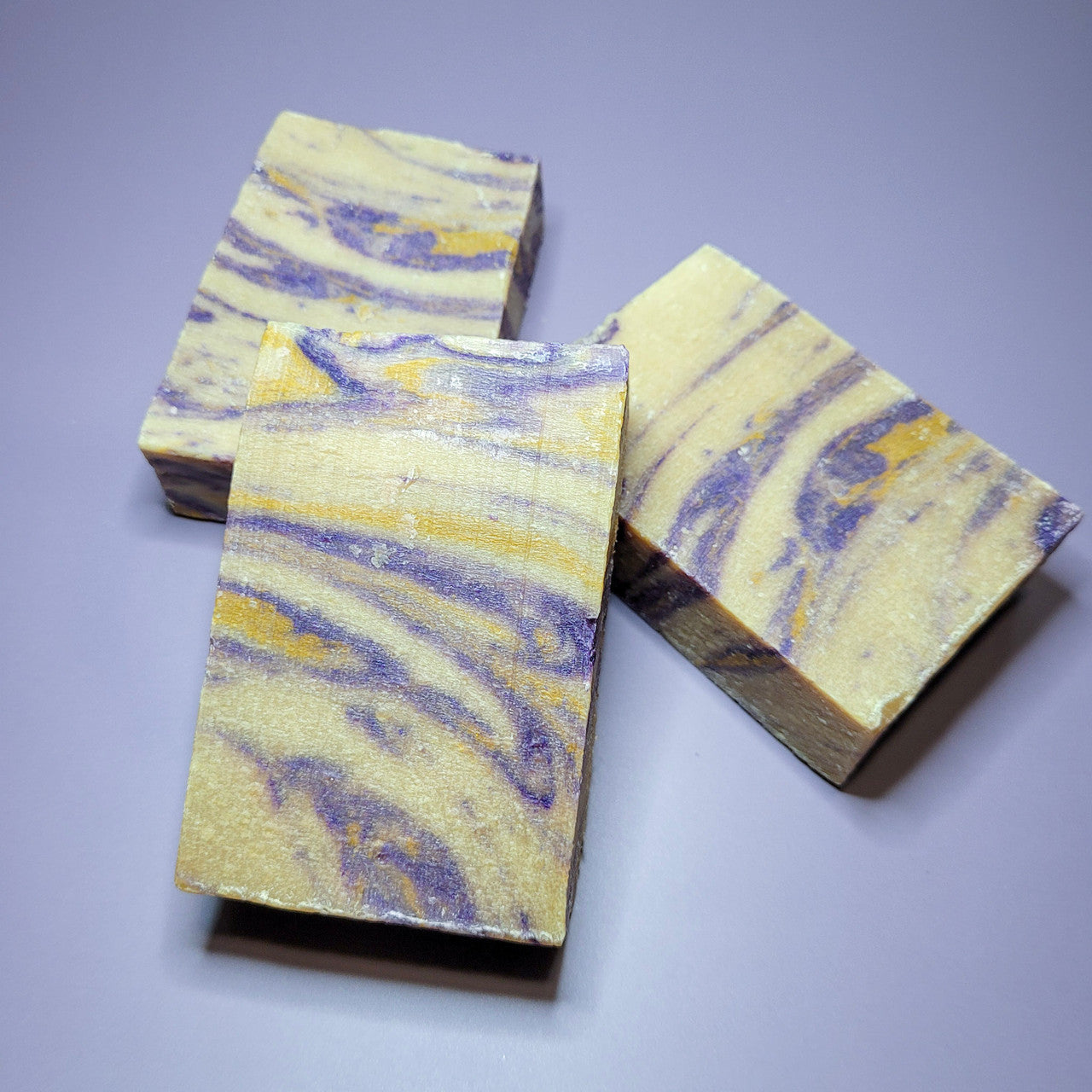 Evolve Botanica lavender and honey standard soap wrapped in unprinted glassine bag, showcasing a natural, handcrafted appearance.