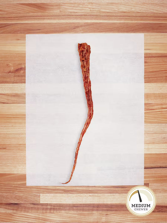 Farm Hounds beef tail chew for dogs, natural and healthy dog treat with a visible beef tail in the image.
