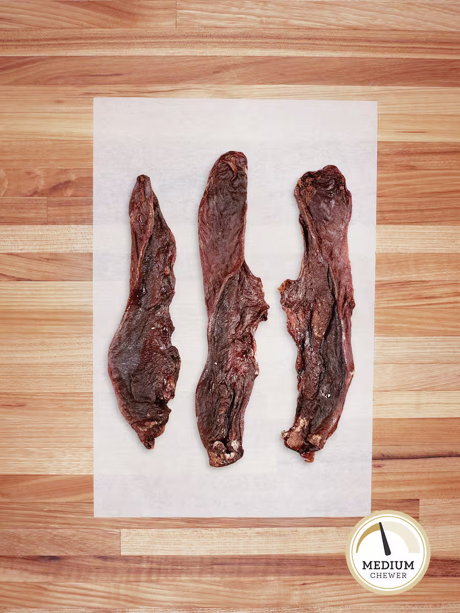 Farm Hounds hog tongue chew for dogs, natural and durable treat made from beef tongue, set on a neutral background.
