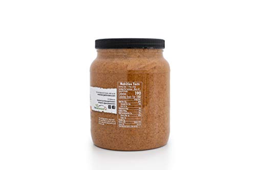Georgia Grinders 64 oz almond butter tub with creamy, natural almond spread in a large plastic container.