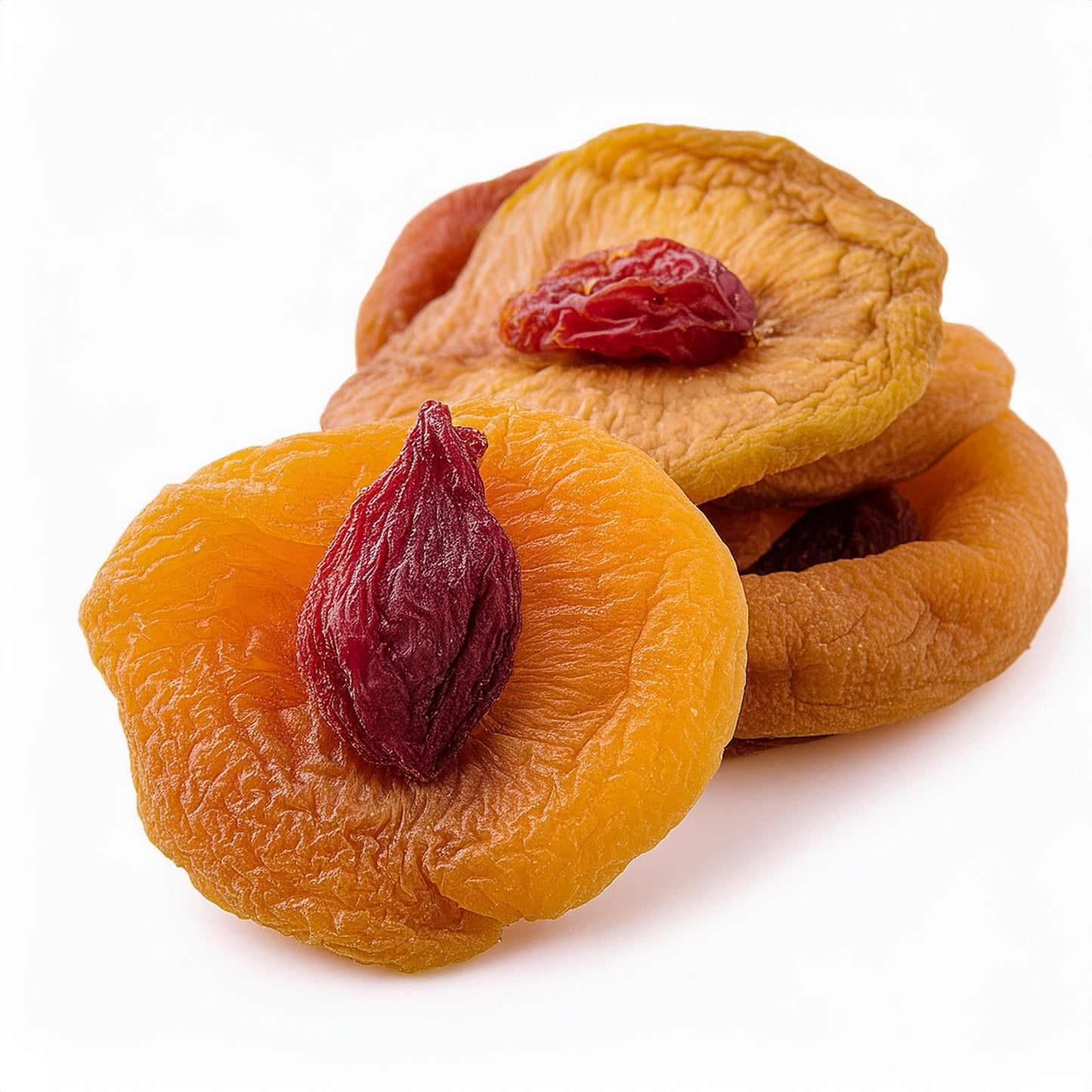Dried peaches from Georgia Peach World, close-up view of vibrant, chewy dried peach slices on a white background.