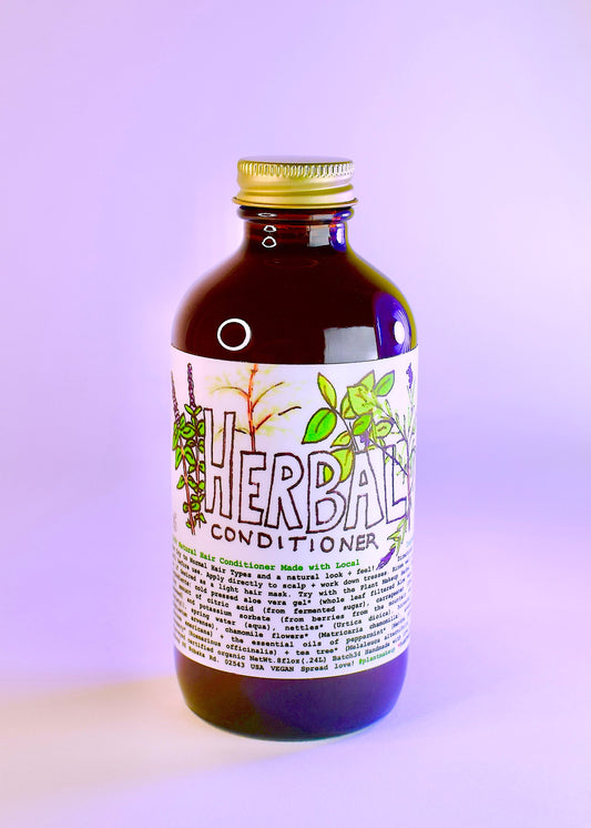 Plant Makeup herbal conditioner bottle with green leaves branding, showing the product label and natural ingredients.