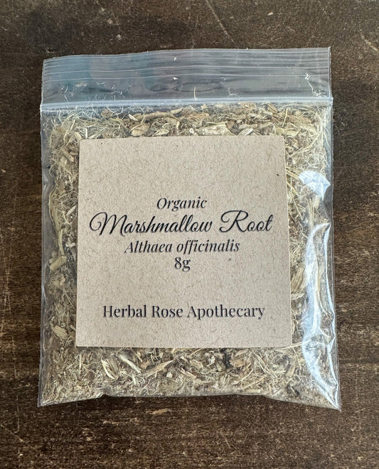 Organic marshmallow root in an 8g package from Herbal Rose Apothecary, showing dried herbal root pieces.