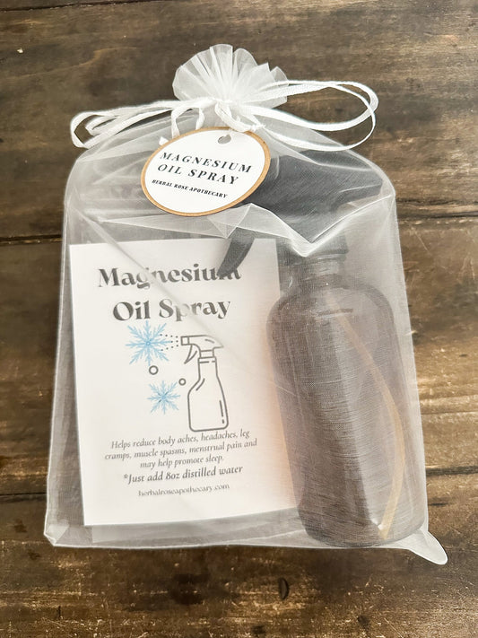 HerbalRoseApothecary DIY magnesium oil spray in a clear glass bottle, part of an apothecary kit for homemade wellness products.
