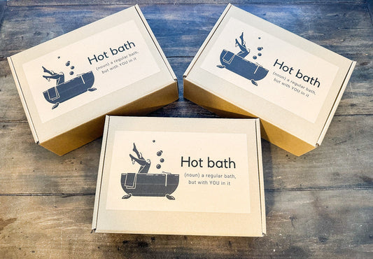 HerbalRoseApothecary bath gift set with calming, moisturizing bath products in a decorative gift box for relaxing self-care.