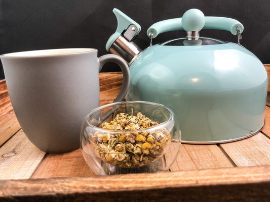 Dried organic chamomile herbs in an 8g package from HerbalRoseApothecary, showing fresh yellow chamomile flowers and green stems.