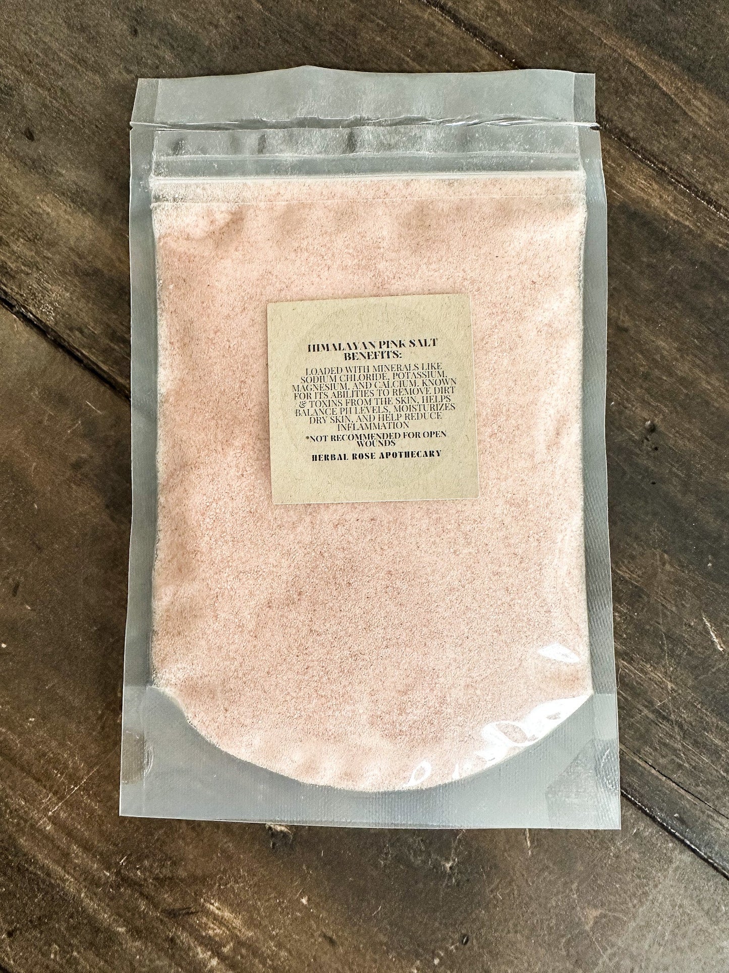 Himalayan Pink Salt from HerbalRoseApothecary, displayed with salts and oats in a natural setting.