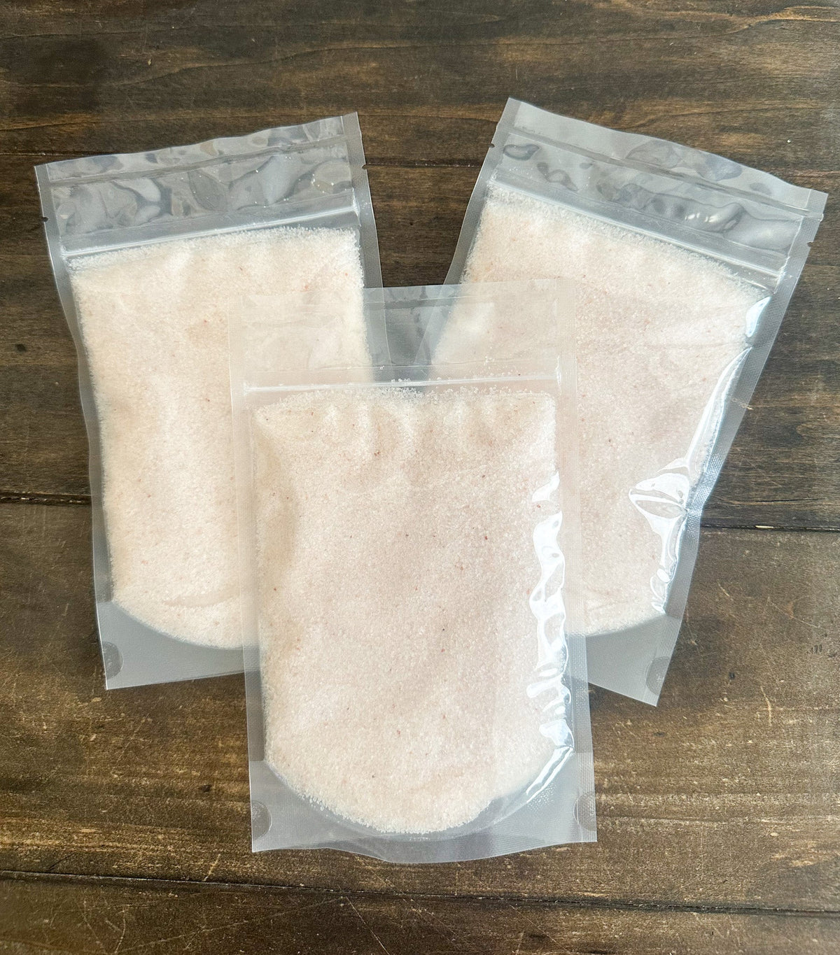 Himalayan pink salt from herbalroseapothecary, showing coarse pink salt crystals suitable for cooking and seasoning.