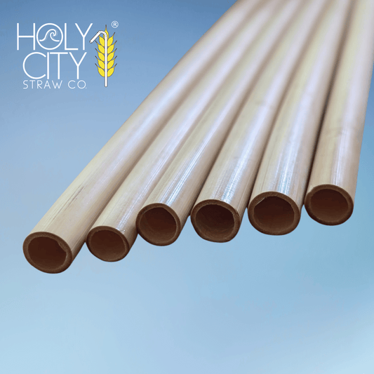 Five 5.5-inch jumbo reed drinking straws by Holy City Straw Company, natural reusable straw for beverages.