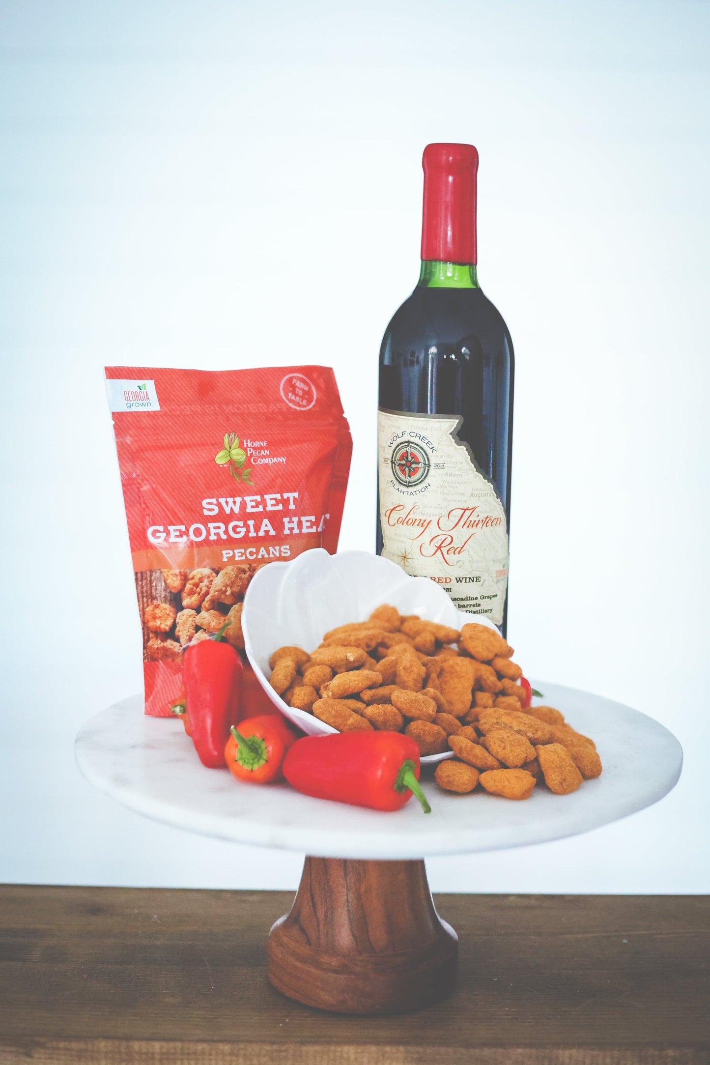Horne Pecan Company Sweet Georgia Heat sweet and spicy pecans in a 2 oz bag, coated with a flavorful blend of spices.