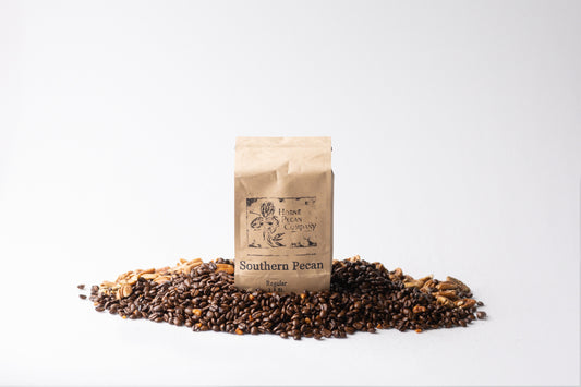 Ground decaf coffee from Horne Pecan Company, 1 lb. Gourmet Pecan Flavored Coffee, with a rich, nutty aroma and breakfast blend appearance.