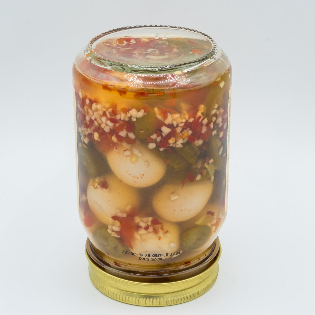 Canned Pickled Jalapeño Quail Eggs in a jar, featuring spicy jalapeños and whole quail eggs, from Amish Country Store.