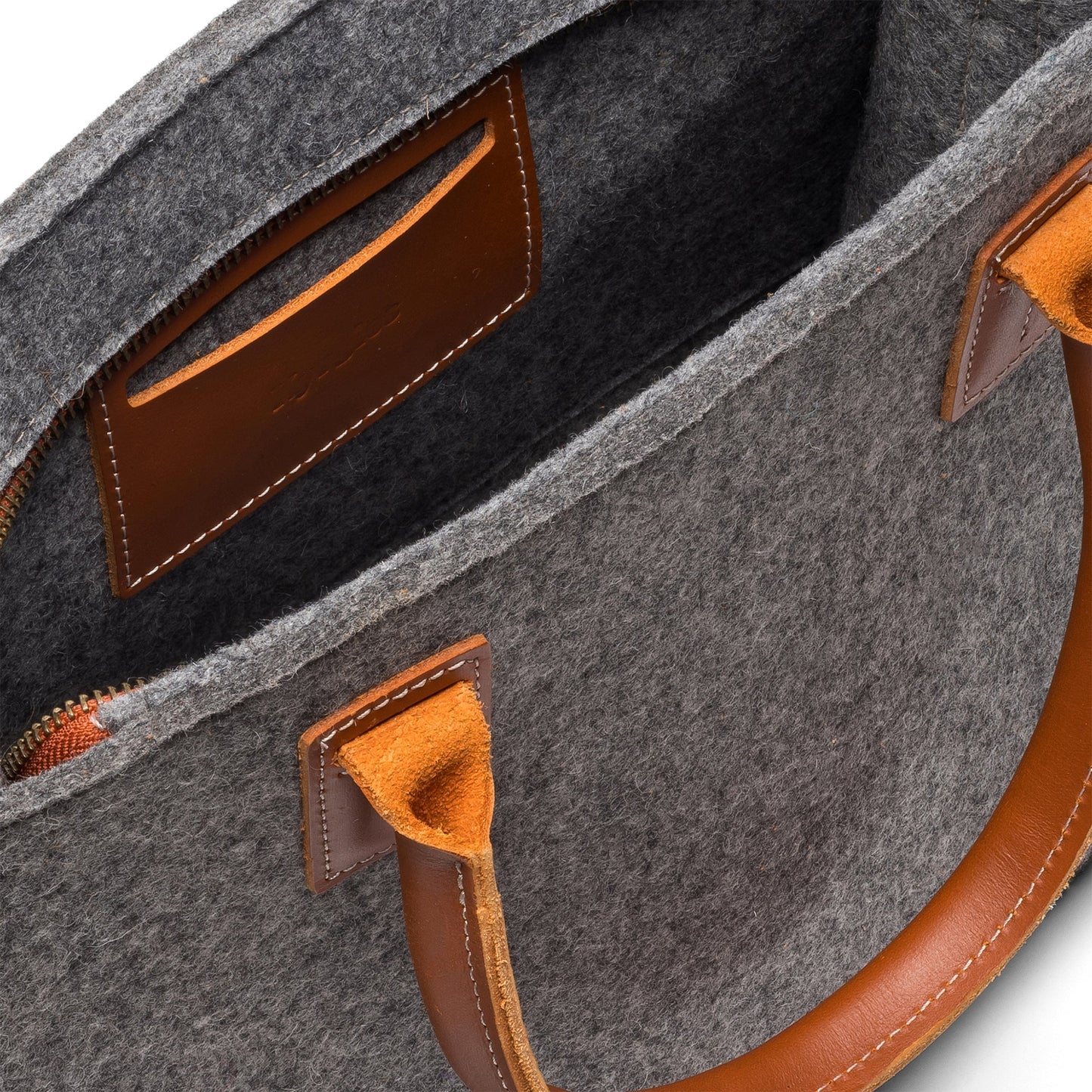 Charcoal Kyrgies handmade wool handbag with rounded shape and top handle, showcasing soft, textured wool material.