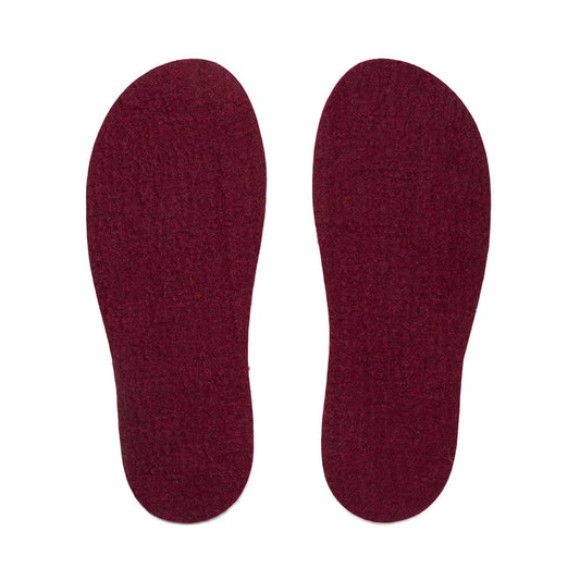 Dark felt insoles by Kyrgies, showing soft, cushioned insoles designed for comfort and warmth in footwear.
