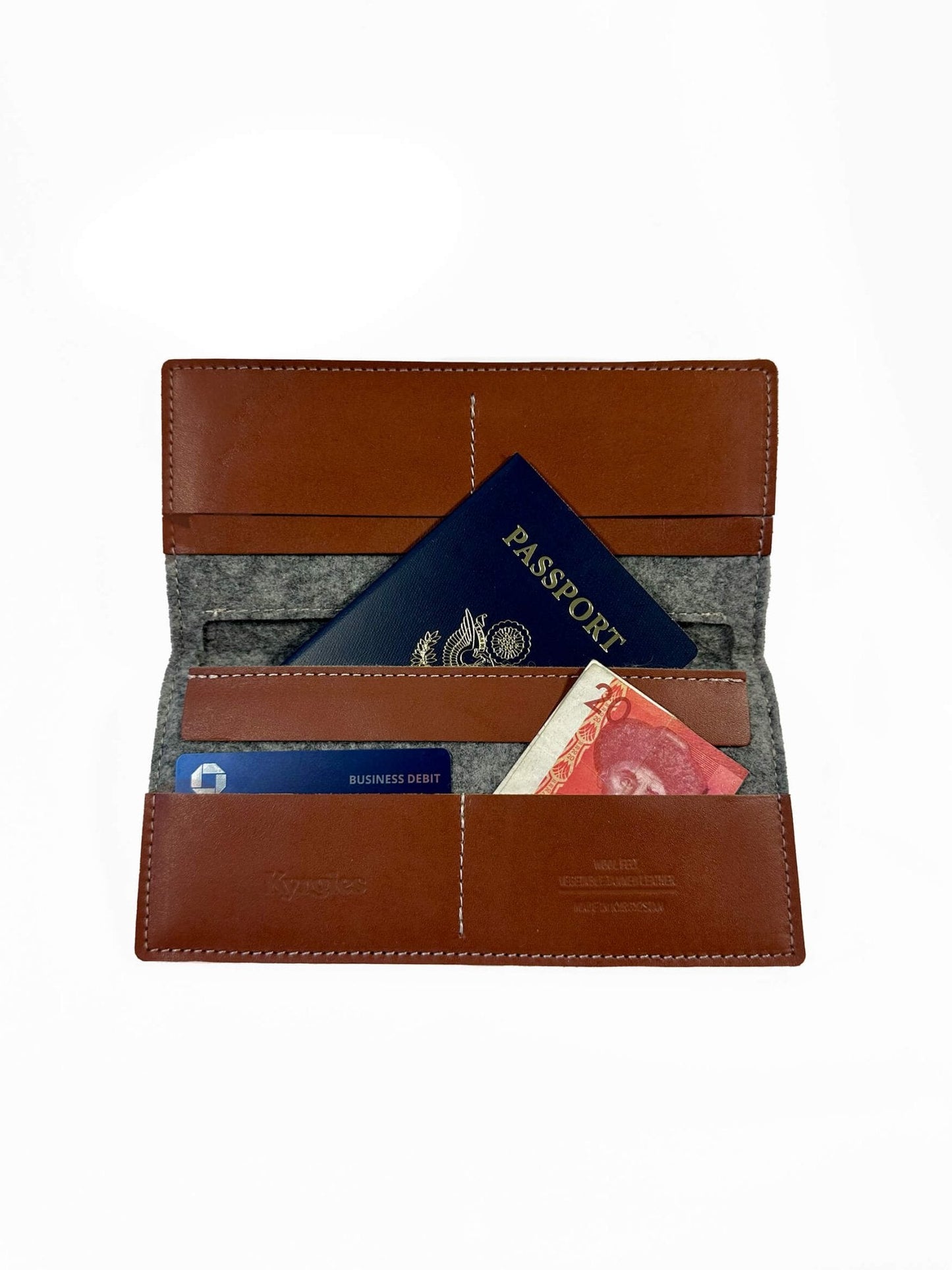 Kyrgies travel wallet made of eco-friendly materials, featuring multiple compartments for cards and cash, in a compact, stylish design.