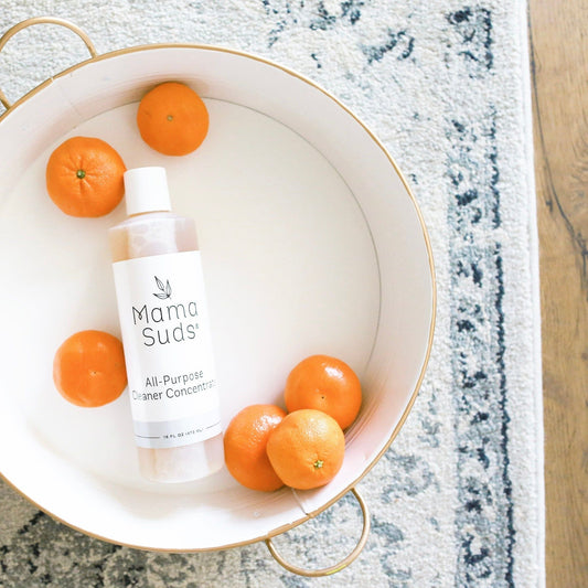 MamaSuds all-purpose cleaner concentrate in a spray bottle, ideal for household cleaning and versatile surface use.