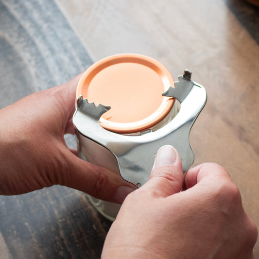 Stainless steel Mason Jar Lifestyle dent-free lid opener with canning lids bundle, designed for easy opening of Mason jar lids.