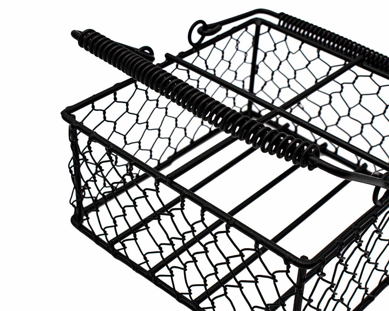 Chicken wire caddy holding four pint Mason jars, designed by Mason Jar Lifestyle for convenient storage and display.