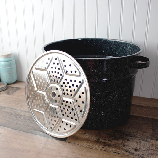 Stainless steel pressure canning rack by Mason Jar Lifestyle, designed to hold jars securely during pressure canning.