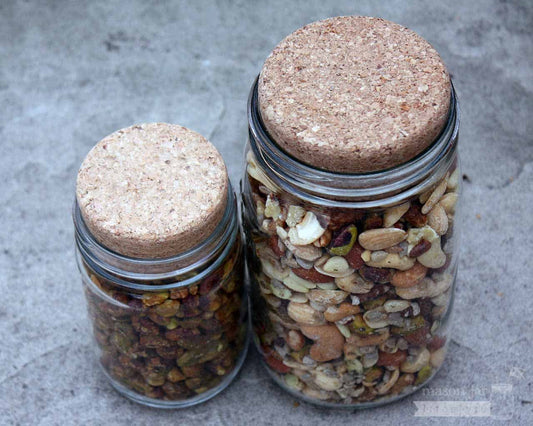 Set of four Mason Jar Lifestyle cork lids for regular-mouth mason jars, perfect for sealing and storing contents.