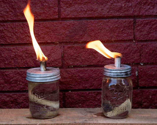 Galvanized metal lid for Mason Jar Lifestyle Tiki Torch Oil Lamp on a mason jar, designed for regular-mouth jars.