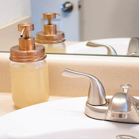 Rose gold soap pump lid kit for regular mouth Mason jars, perfect for bathroom or kitchen soap dispensers, reusable and stylish.