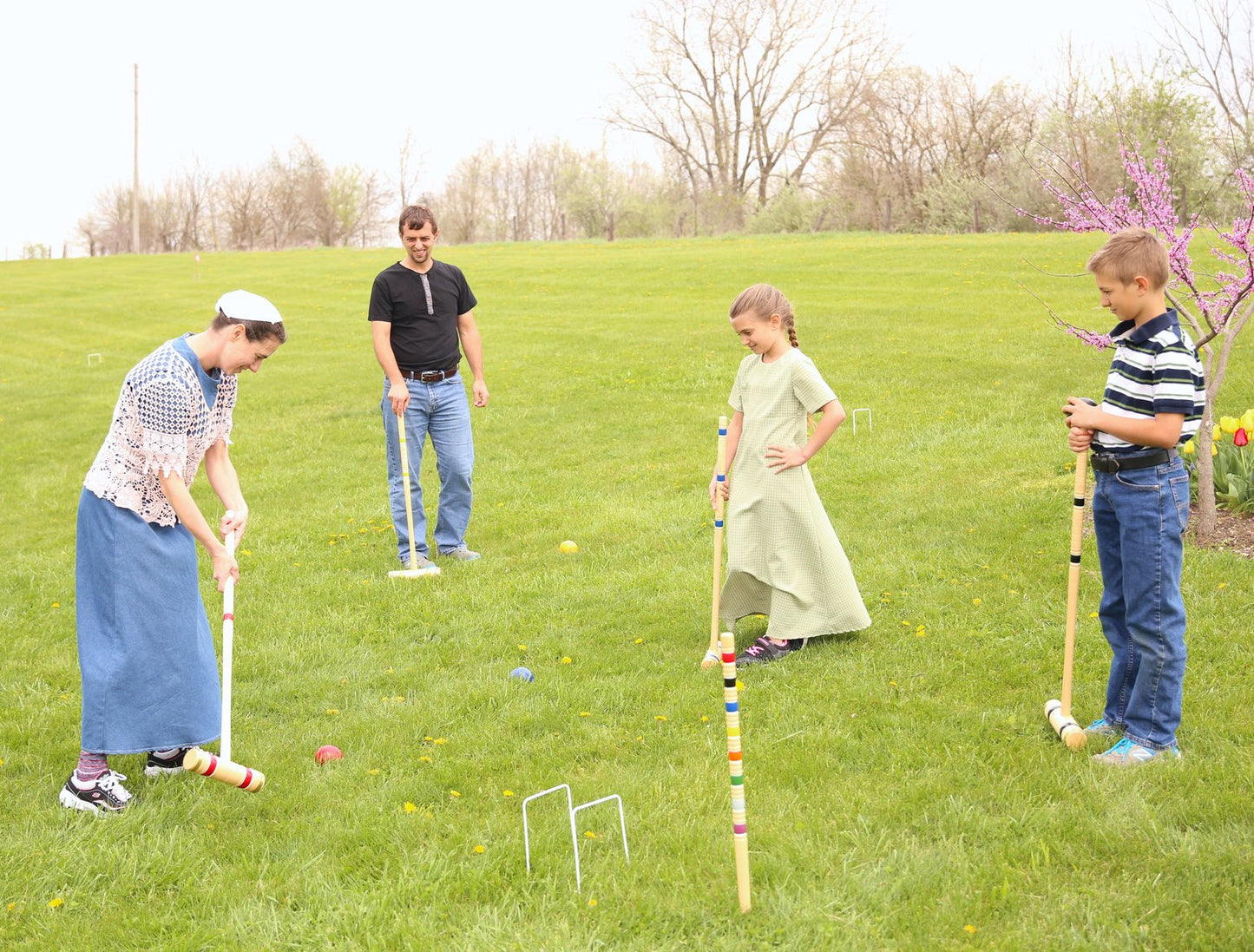 Amish-made Deluxe Croquet Game Set for 6 players with wooden holder, wooden toys, games, and puzzles, ready for outdoor play.