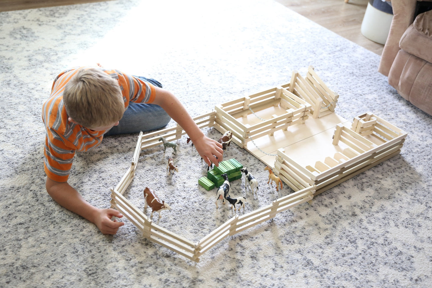 Amish-made wooden folding stock yard farm toy, unfinished, showing detailed craftsmanship and natural wood finish.