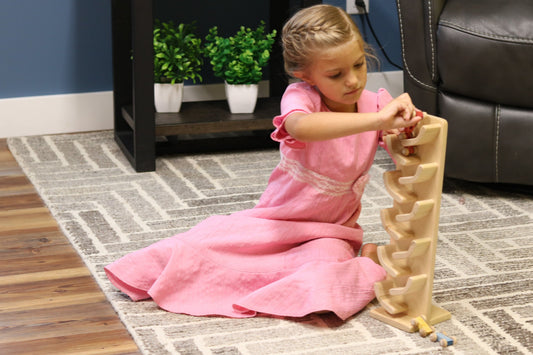 Amish-made wooden mini car roller toy with colorful cars, crafted by AmishToyBox.com, ideal for children’s play and development.