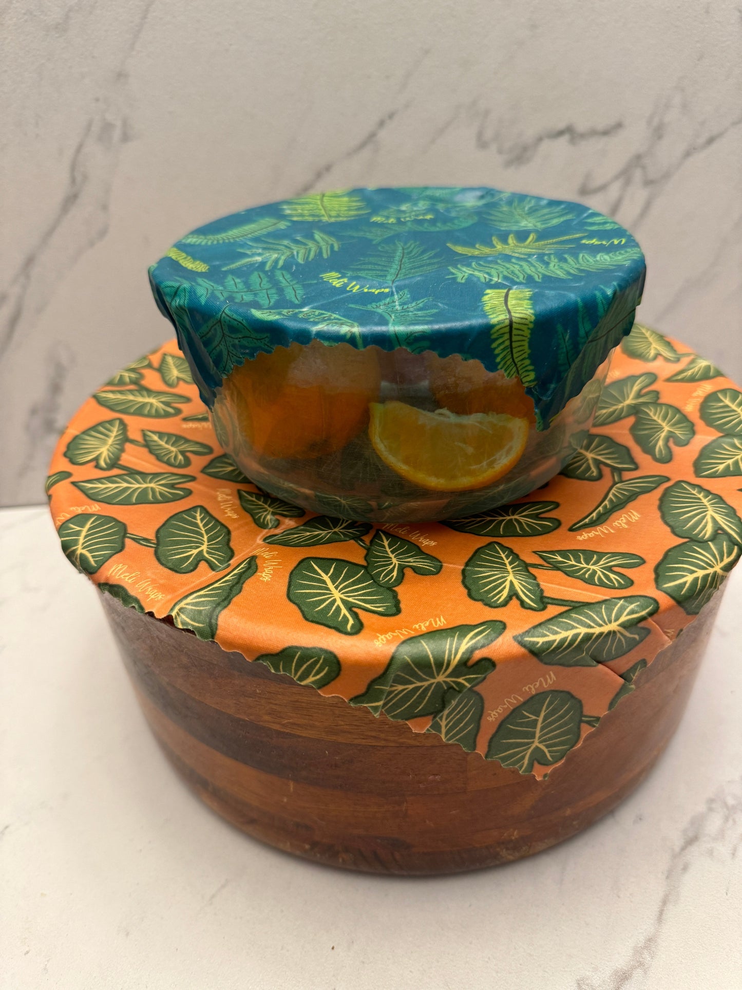 Set of three Meli Wraps beeswax food wraps in small, medium, and large sizes with colorful Kalo print design.