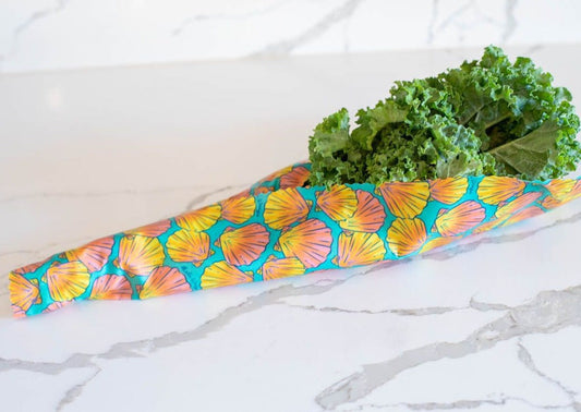 Set of Meli Wraps beeswax food wraps with sunrise shell print, in small, medium, and large sizes for eco-friendly food storage.