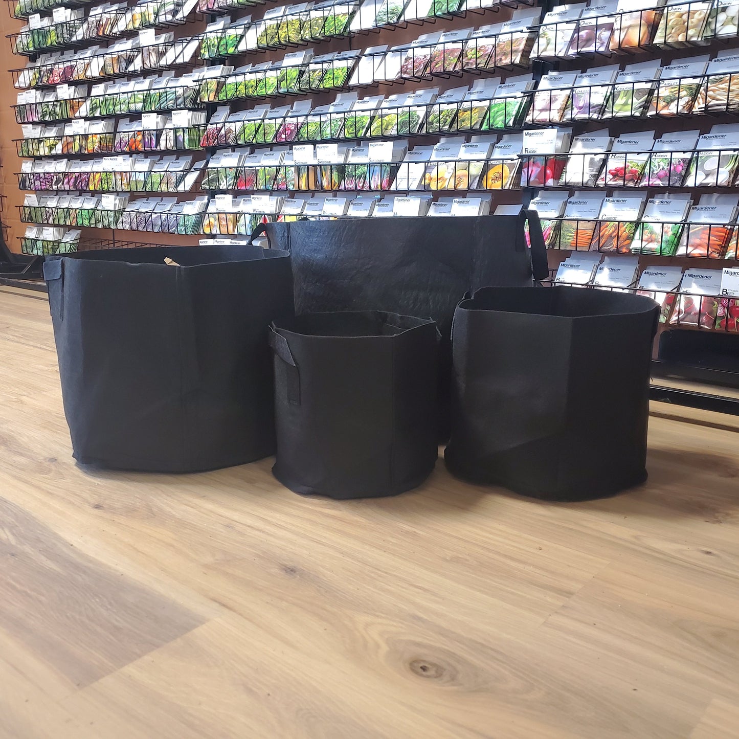 MIgardener fabric grow bags in 3-gallon size, sturdy black containers ideal for gardening and plant cultivation.