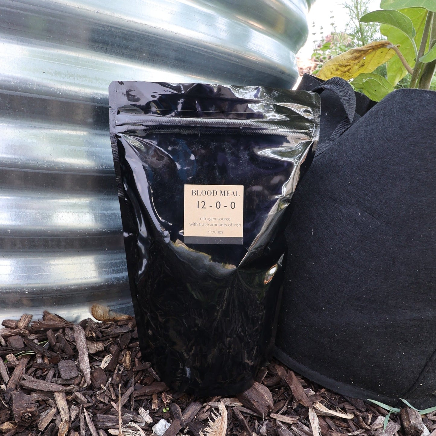 Bag of MIgardener Blood Meal, 2lb, organic fertilizer for boosting plant growth and soil health.