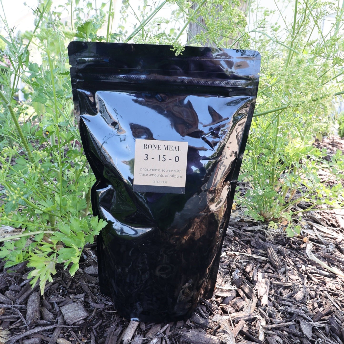 MIgardener Bone Meal fertilizer in a 2lb bag, natural plant supplement for soil enrichment and root development.